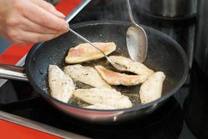 frying red mullet fish fillets photo