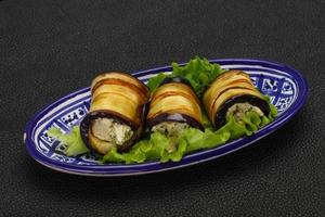 Stuffed eggplant roll with cheese and herbs photo