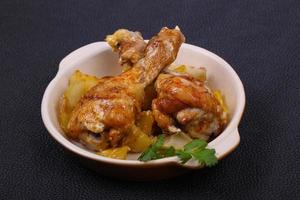 Roasted chicken legs with potato photo