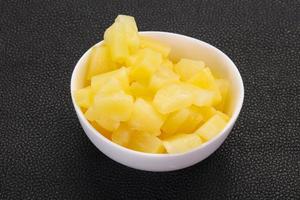 Marinated pineapple pieces photo