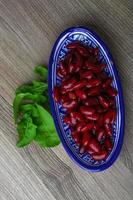 Kidney beans in a bowl on wooden background photo