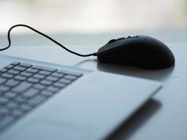 notebook with mouse on the table photo