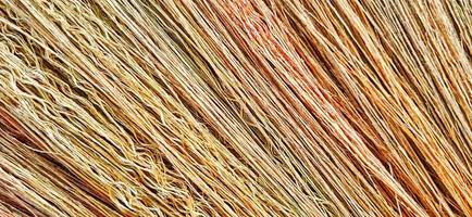 Colorful abstract broom straw texture. Grunge texture of dry straw background design. Suitable for promotion, poster, wallpaper, presentation, agriculture, advertising of company and industry. photo