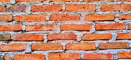 Red orange clay brick wall patterns. Classic architecture background design. photo
