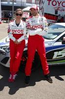 LOS ANGELES, APR 9 -  Kate del Castillo, Jesse Metcalfe at the Toyota ProCeleb Race Press Day 2013 at the Toyoto Grand Prix Circuit on April 9, 2013 in Long Beach, CA photo