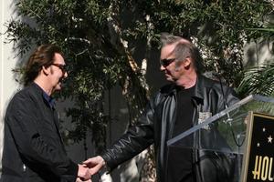 LOS ANGELES, FEB 9 - Paul McCartney, Neil Young at the Hollywood Walk of Fame Ceremony for Paul McCartney at Capital Records Building on February 9, 2012 in Los Angeles, CA photo