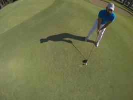 top view of golf player hitting shot photo