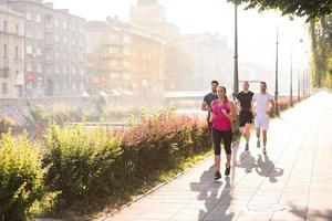 group of young people jogging in the city photo