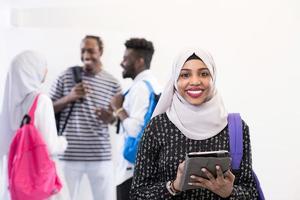 african female student with group of friends photo