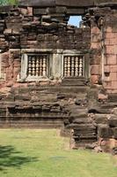 Sand stone window of the historical castle in Thailand. photo