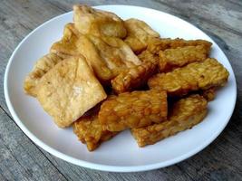 Tempe goreng or Fried Tempeh on a plate. Indonesian culinary food photo