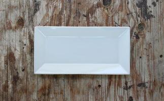 Empty plate in the wood photo