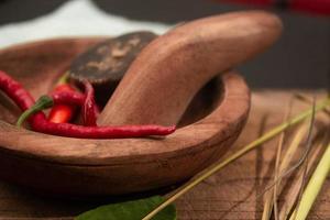 herbs and wooden mortar and pestle. suitable to print on restaurant poster photo