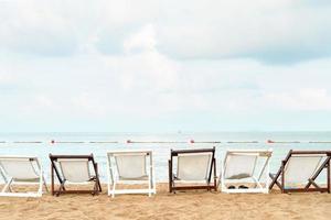 White beach chair  with blue sky and sea view photo