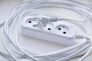 White electric extension cord, great design for any purposes. White background. photo