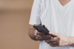 echnology concept social media man using smart phon access online media Through the Internet, there is marketing to answer customer chats. by working at home photo
