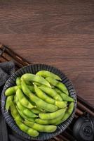 Top view of fresh boiled edamame with copy space. photo