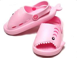 Picture of pink sendals that has shark shape photo