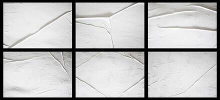 Set of blank white glued paper for poster texture overlay. Crumpled and wrinkled pattern for background. Collection of matted wet paper for mockup posters, flyer,  brochure, and banner design photo