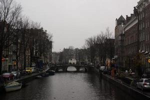 Amsterdam, Netherlands, 2015 - View of an old Amsterdam canal bridge photo