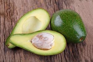 Avocado on a wooden background photo