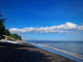 abstract blur background of beach with bright blue sky photo