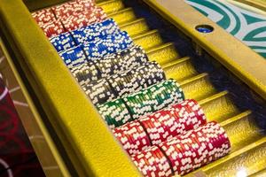 gambling chips  on a game table roulette photo