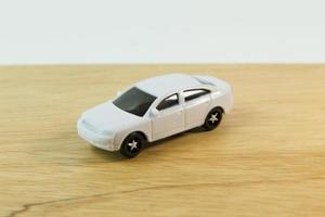 white car toy on wood table  image close up.