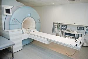Magnetic resonance imaging scan or MRI machine device in hospital. photo