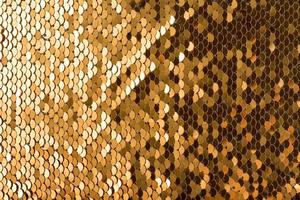 Sequins background. Multicolored sequins. Background with shiny sequins on fabric. photo