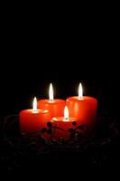 four red christmas candles photo