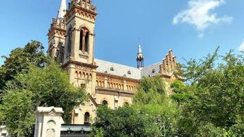 Batumi, Georgia, 2022 - Cathedral of the Mother of God in Batumi, Georgia. Beautiful decoration with gothic revival design. Blue sky during the sunny day video