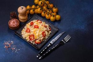 Homemade chinese fried rice with vegetables and a chicken photo