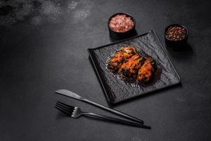 Dolma, stuffed grape leaves with rice and meat on a dark background photo
