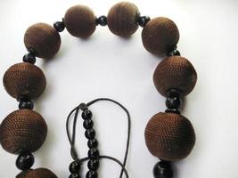 Women necklace. Collection of fashionable necklaces made of wood, beads isolated on a white background. Beauty, jewelry, accessory. photo