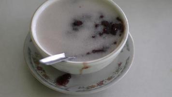 Indonesian black sticky rice porridge, which is very popular with people for dessert at a meal photo