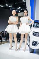 Nonthaburi, Thailand - MAR 27, 2021 Unidentified model poses with a car at The 42th Bangkok International Motor Show Thailand 2021 at IMPACT Arena photo