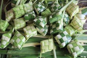 Ketupat or Rice Dumplings. Ketupat is a natural rice sleeve made from young coconut leaves to cook rice which is always available during Islamic holidays photo