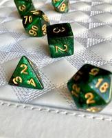 Dice game green polyhedral, MTG dice and cards. photo