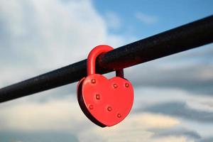 Heart shapeed lock - a symbol of love on the embankment photo