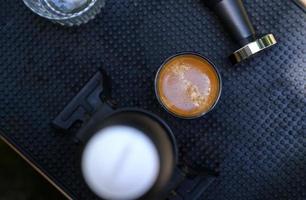 Beautiful crema coffee in a glass. photo