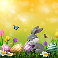 Easter greeting card with a little rabbit, colorful eggs and flowers in the grass vector