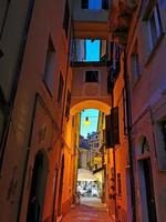MONTEROSSO AL MARE, ITALY - JUNE, 8 2019 - Pictoresque village of cinque terre italy is full of tourist at night photo