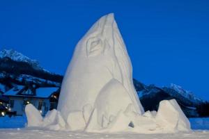 A huge whale ice sculpture at night photo