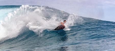 TAHITI, FRENCH POLYNESIA - AUGUST 5 2018 - Surfer training days before Billabong Tahiti Competition at Teahupoo reef photo