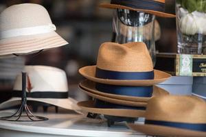 classic men and women hats for sale in a shop photo