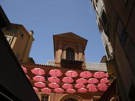 Grasse France pink umbrellas street photo