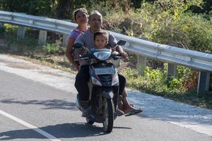 DENPASAR, BALI, INDONESIA - AUGUST 15, 2016 - Indonesia people biking photo