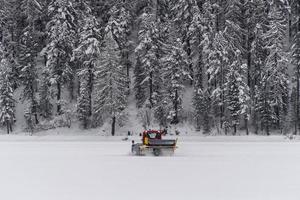 snowmobile on ski run and snow photo