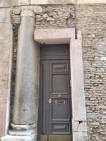 old roman columns inside medieval building in rome photo
